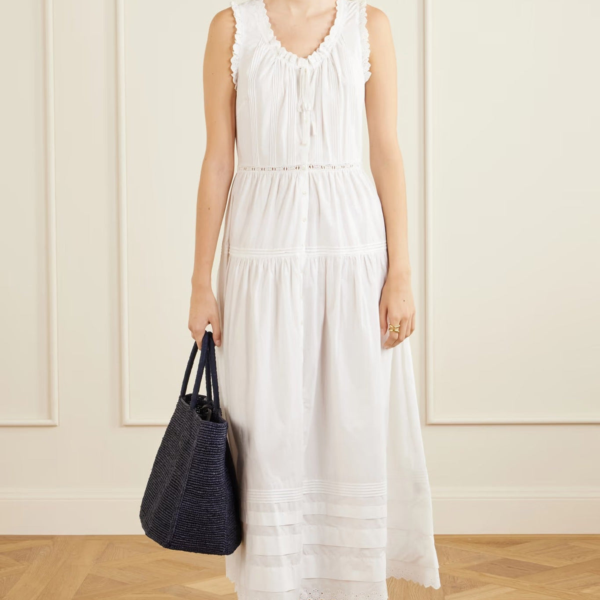 White sleeveless midi dress with ruffles