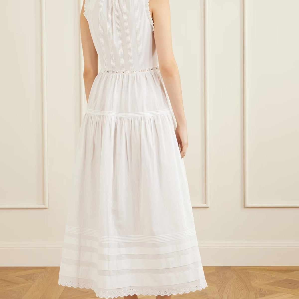 White sleeveless midi dress with ruffles